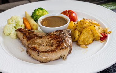 porkchop served on white dish