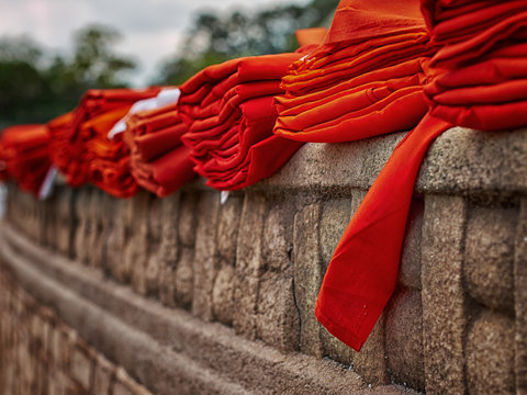 Sri Lanka, Anuradhapura, Red monks robes on fortified wall