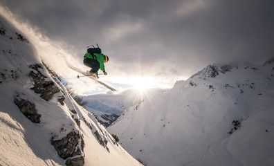 Side view of man skiing on snowcapped mountain