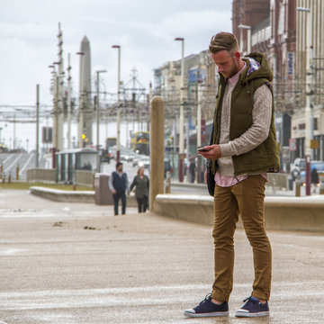 UK, England, Blackpool, Man texting