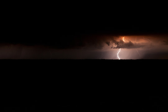 Storm over lake at night