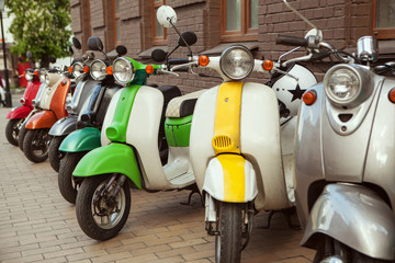 Fototapeta na wymiar Row of mopeds on a street 