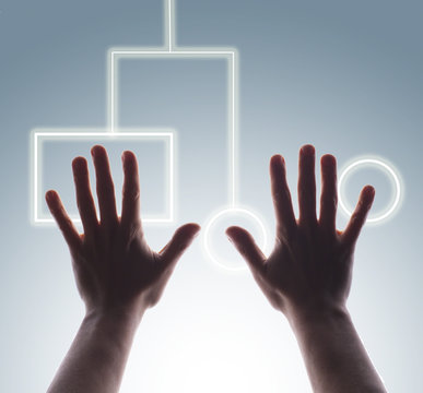 Studio shot of man's hands touching digital touch screen buttons