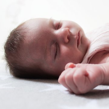 Baby girl (0-1 months) sleeping