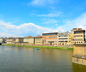 Fototapeta na wymiar Arno river on a sunny day in Florence