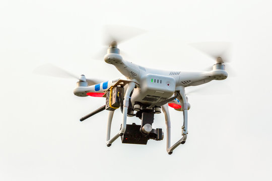 Studio shot of drone flying against white background