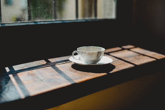 Italia, Lombardia, Pavia, Cup of coffee beside window