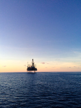 Oil rig at sunset