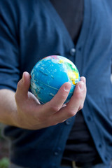 Man Holding a Globe Earth