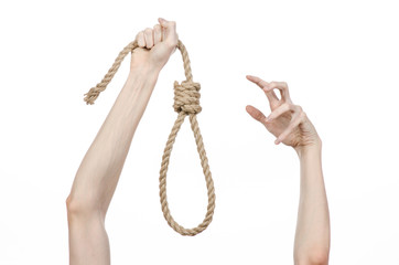 man's hand holding a loop of rope for hanging on isolated