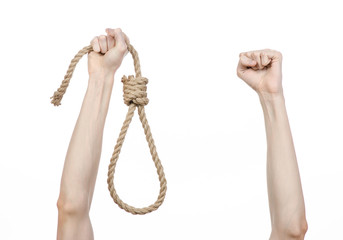 man's hand holding a loop of rope for hanging on isolated