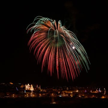 Malta, Fireworks exploding over illuminated skyline