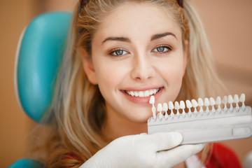 Deantist woman teeth whitening dental clinic
