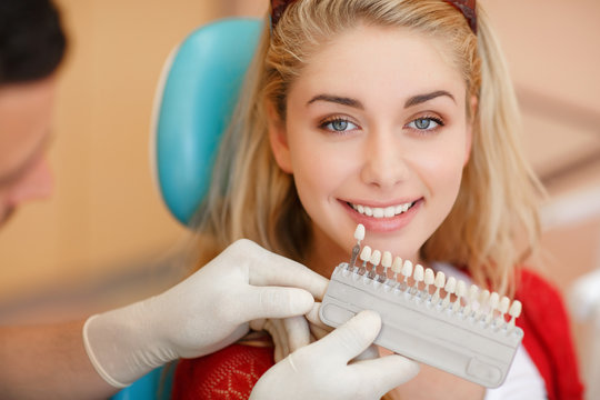 Deantist woman teeth whitening dental clinic