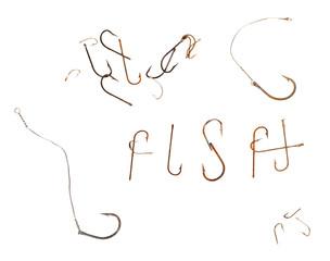 Word F I S H and old rusty fish hooks