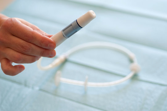 Germany, Hand holding medical equipment