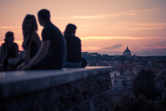 Silhouette of People at Giardino degli Aranci Park (Parco Savello) looking at sunset over the city, Rome, Lazio, Italy	