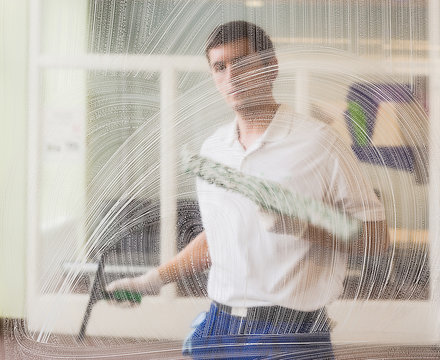 Germany, Man washing windows
