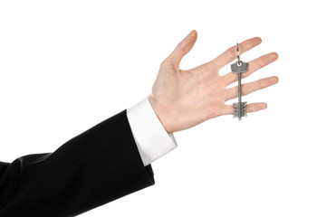 Fototapeta premium real estate agent in his hand the key to a new apartment