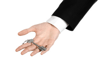 Fototapeta premium real estate agent in his hand the key to a new apartment