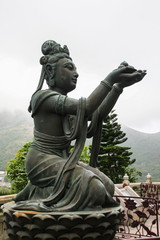 Obraz premium Angels statue praising to the Big Buddha at Lantau, Hong Kong