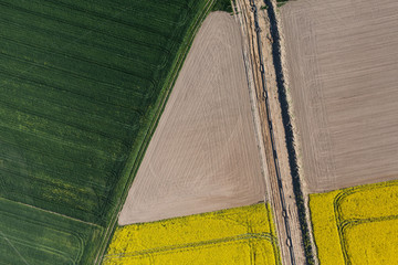 aerial view of burying gas pipe in a country harvest fields  are