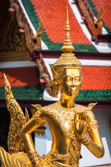 Golden Kinnari statue at Temple of Emerald Buddha (Wat Phra Kaew