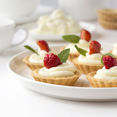 Cupcakes with fresh fruits, whipped cream and mints