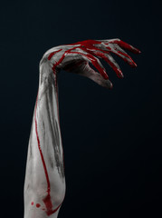 horrible zombie demon bloody hands on a black background