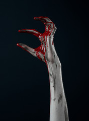 horrible zombie demon bloody hands on a black background
