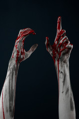 horrible zombie demon bloody hands on a black background