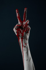 horrible zombie demon bloody hands on a black background