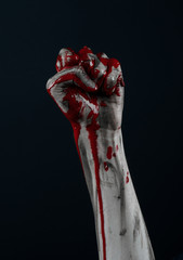 horrible zombie demon bloody hands on a black background