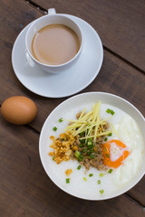 Congee of traditional food Chinese style with soft-boiled egg