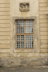 Old wooden window with bar