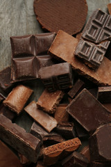 Set of chocolate on wooden table, closeup