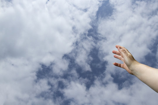 Hand reaching to heavens