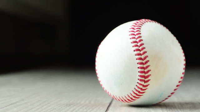 baseball ball rotation on wooden floor