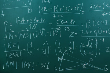 Maths formulas on chalkboard background