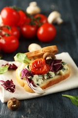 Tasty sandwich on wooden table, close up