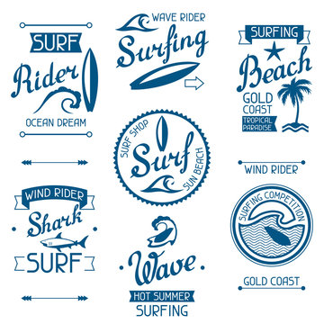 Set surfing labels and emblems on white background