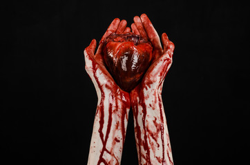 terrible bloody hand hold torn bleeding human heart isolated - obrazy, fototapety, plakaty