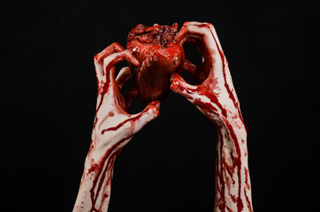 terrible bloody hand hold torn bleeding human heart isolated