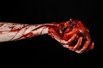 terrible bloody hand hold torn bleeding human heart isolated