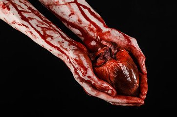 terrible bloody hand hold torn bleeding human heart isolated