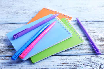 Colorful stationery on wooden table, closeup