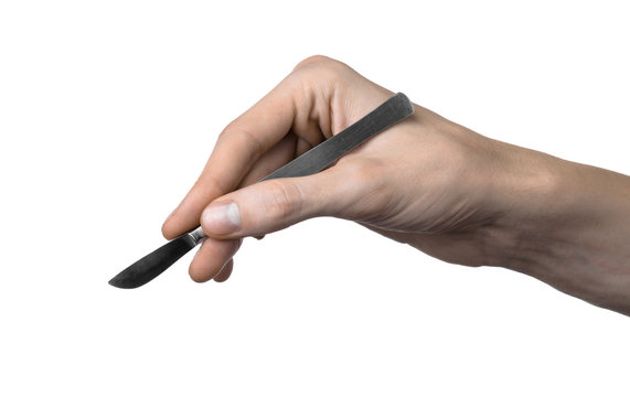 The hand holding the scalpel, white background, isolated studio