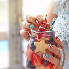 Fototapeta premium Cocktail with strawberry, blueberry and apple