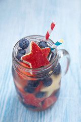 Cocktail with strawberry, blueberry and apple