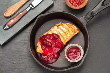 Chicken breast roasted  in pan and cranberry sauce
